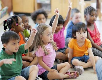 Children learning at circle time Children learning at circle time